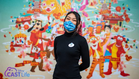 Disney Cast Life - Lisa Kang in front of her mural