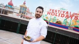 Nick standing in front of Festival of Holidays sign