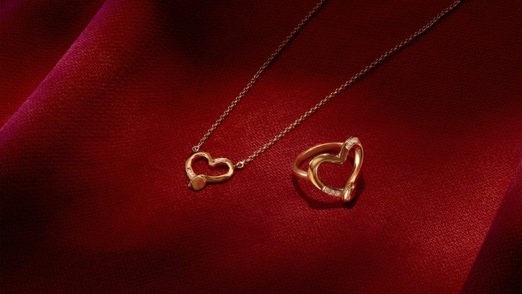 gold heart shaped necklace and ring