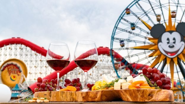 wine and cheese board display with Mickey Fun wheel and Pixar Pier in background