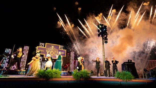 Fireworks burst and Disney characters dance to an exciting musical performance