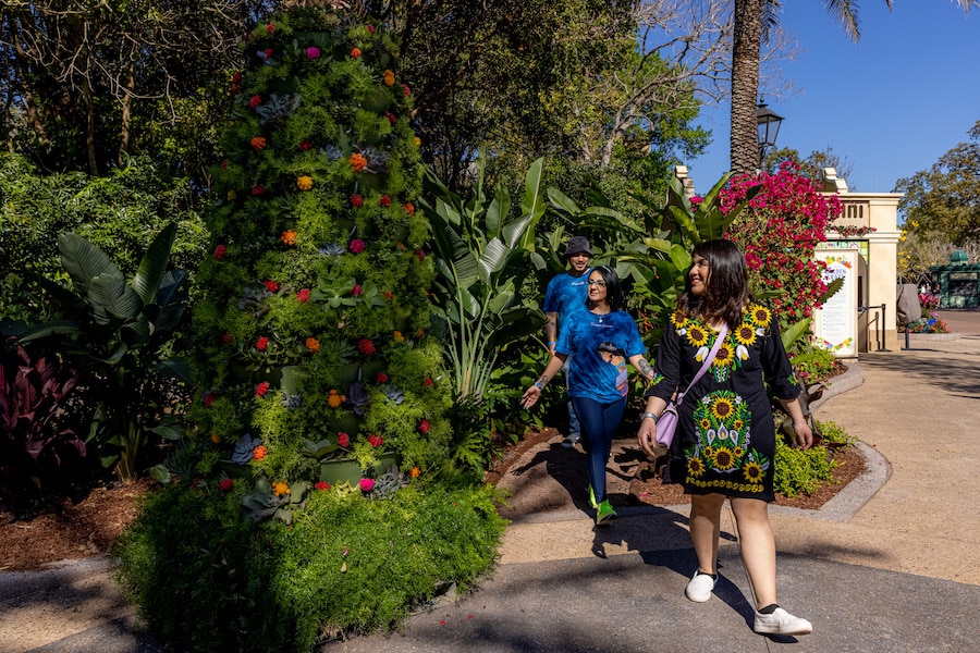 Guests visiting the “Encanto”-inspired garden at EPCOT