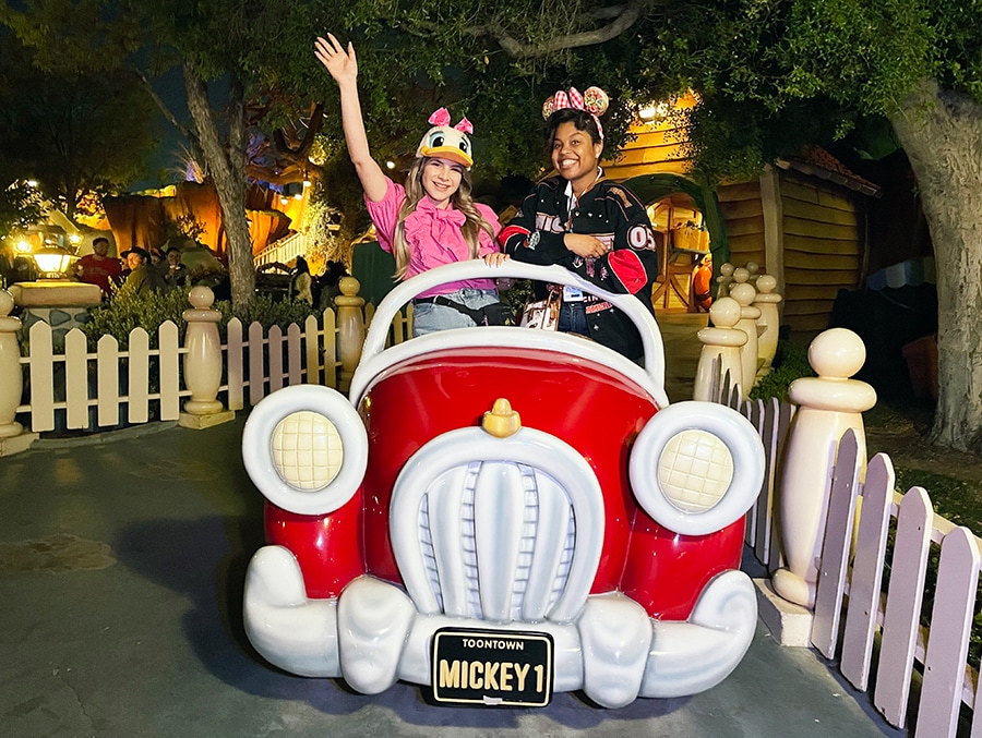 Disneyland Resort cast members pose with iconic Toontown landmarks