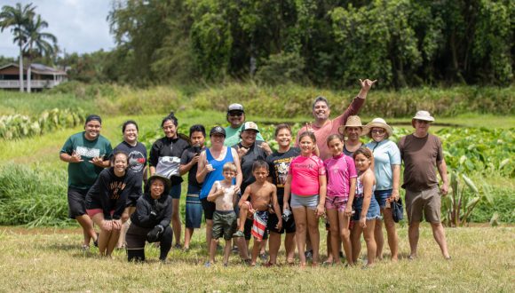 Aulani cast members and their families pose on a farm