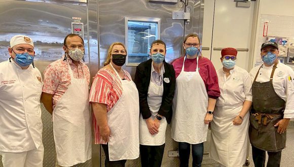 Cast members pose inside Boudin Bakery