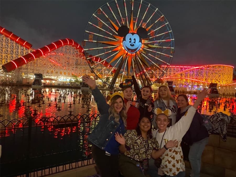 Disneyland Resort cast members at Pixar Pier celebrating the return of World of Color