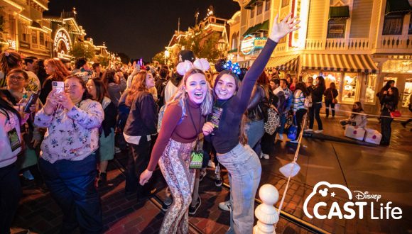Disneyland Resort cast members celebrating the return of nighttime spectaculars