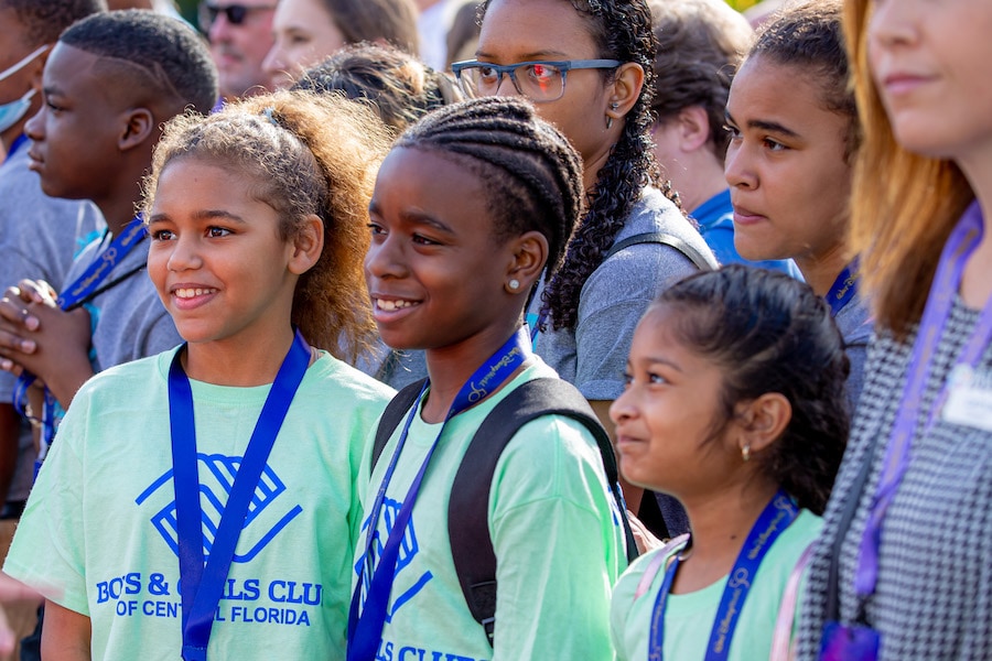 Boys & Girls Clubs students smiling together outside of Guardians of the Galaxy: Cosmic Rewind