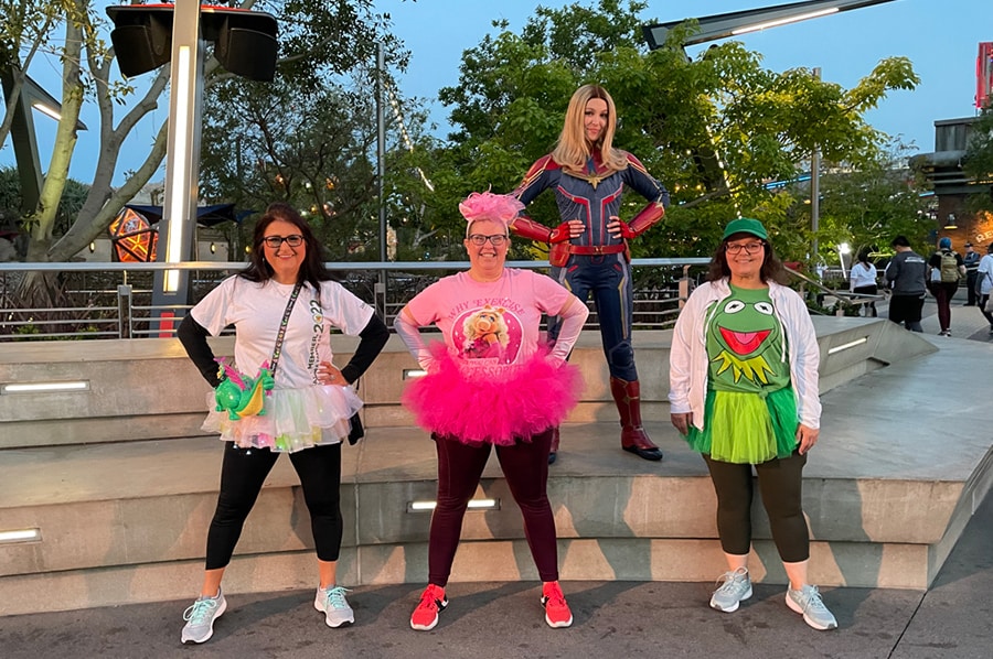 Disneyland Resort cast members pose with Captain Marvel during their race