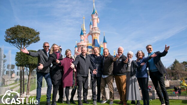 Walt Disney Imagineers in front of Sleeping Beauty's Castle