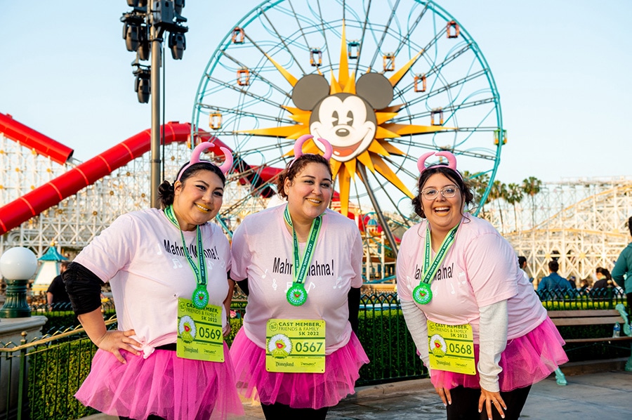 Disneyland Resort cast members pose in front of Pixar Pier after their race