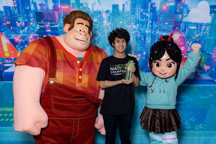 McKenzie Memphis from North Mesquite High School near Dallas celebrates with Wreck-It Ralph and Vanellope von Schweetz after becoming the Super Smash Bros Ultimate video game champion at the first-ever in person Walt Disney World EGF High School National Championship at ESPN Wide World of Sports Complex