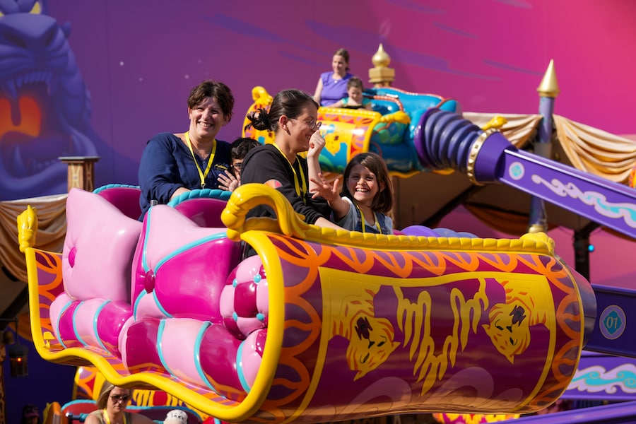 Young patients and families enjoying attractions at Disneyland Paris
