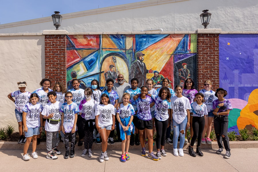Orlando’s After-School All-Stars Drawing Club in front of Everett Spruill's artwork at Disney Springs