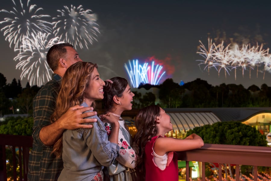 Family watching the fireworks at Disneyland Resort