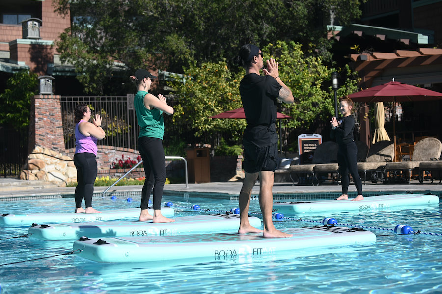 Guests doing Paddleboard Yoga