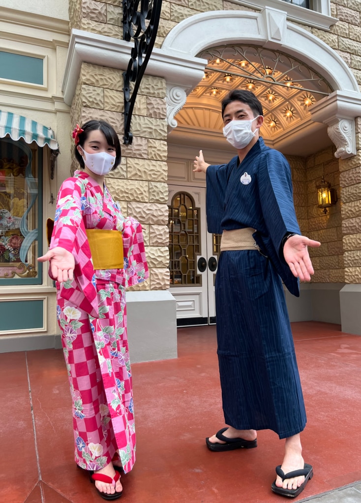 Mika with cast member at Tokyo Disneyland