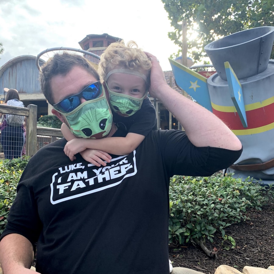Luke with family member, both in Star Wars merchandise