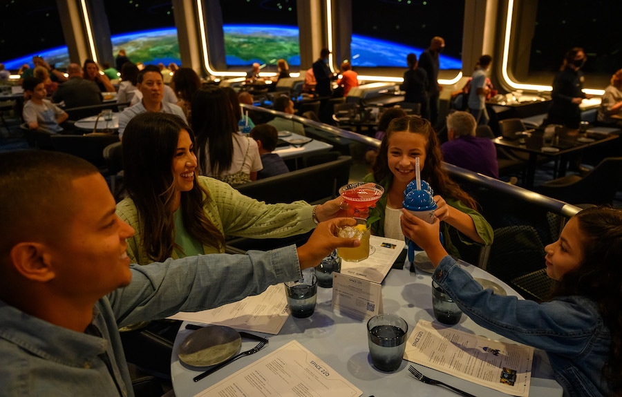 Family raising drinks at Space 220 Restaurant
