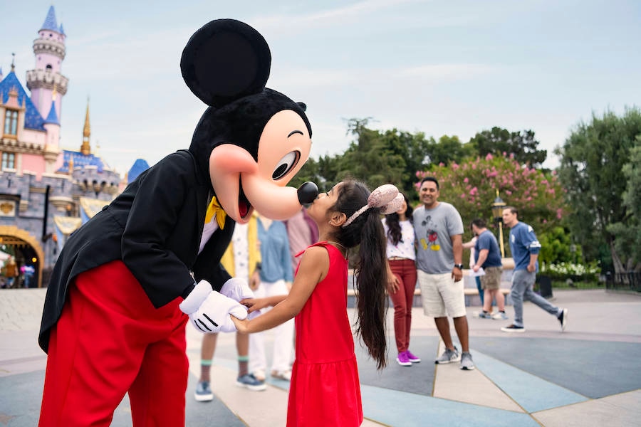 Guest meeting Mickey Mouse at Disneyland park