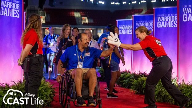 2022 Warrior Games guests high-fiving volunteers