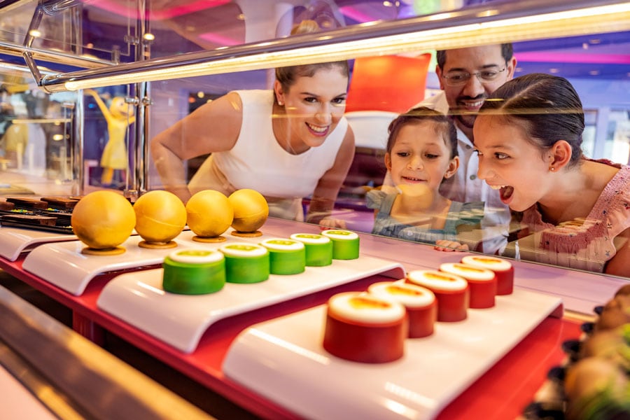 Family looking at new sweet treats offered onboard Disney Wish