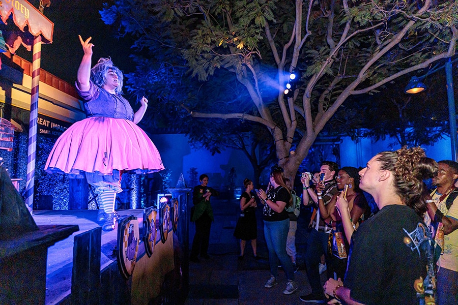 Madame Mim delights partygoers at an interactive treat trail