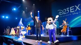 Disney Parks, Experiences and Products Chairman Josh D’Amaro with Mickey Mouse at D23 Expo 2022
