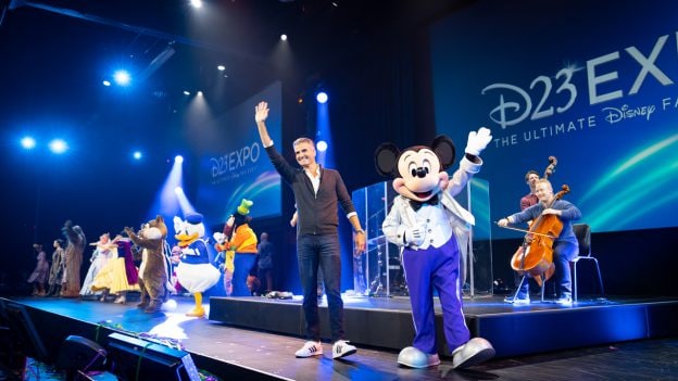 Disney Parks, Experiences and Products Chairman Josh D’Amaro with Mickey Mouse at D23 Expo 2022