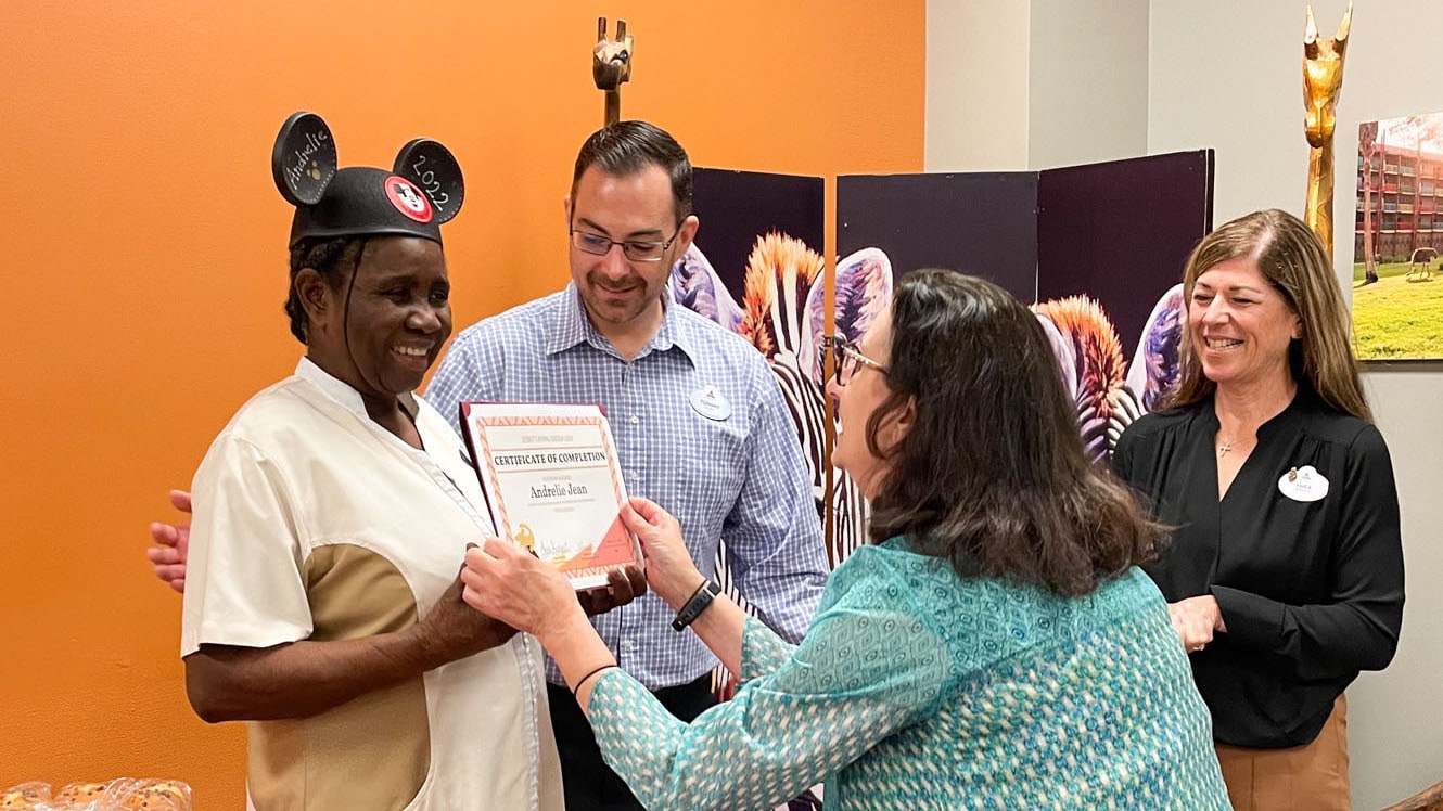 Housekeeper receiving award