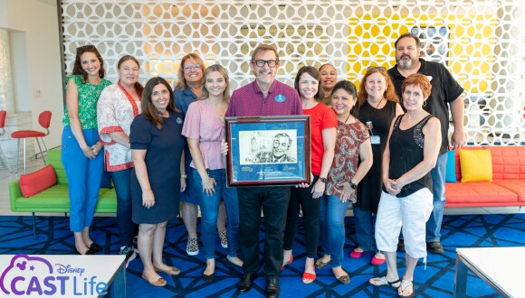 Rick and team holding award