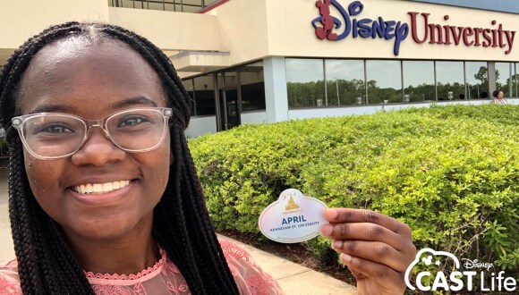 April holding nametag in front of Disney University