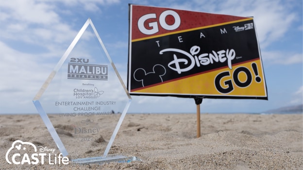 Go Disney Go sign in sand