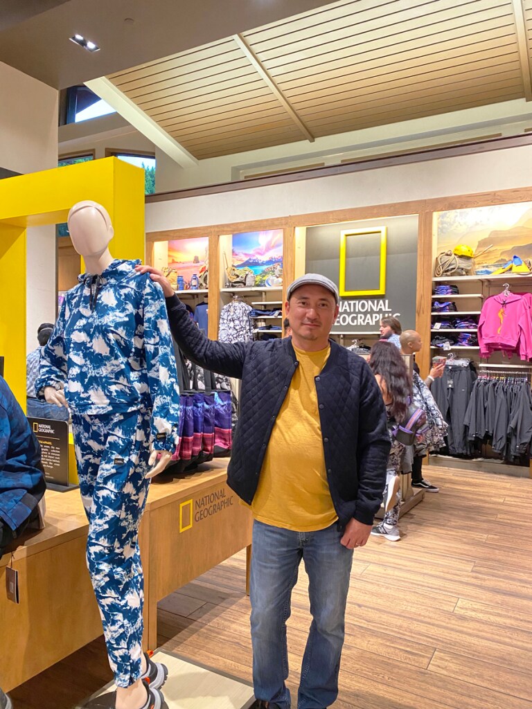 Nick Jeong standing next to mannequin