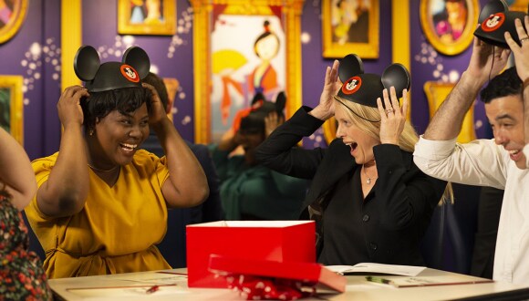 Cast Members putting on Mickey ears