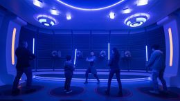 Passengers learn the ancient art of wielding a lightsaber in the Lightsaber Training Pod onboard the Halcyon starcruiser in Star Wars: Galactic Starcruiser