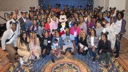 Attendees of a Disney Institute program with Mickey Mouse
