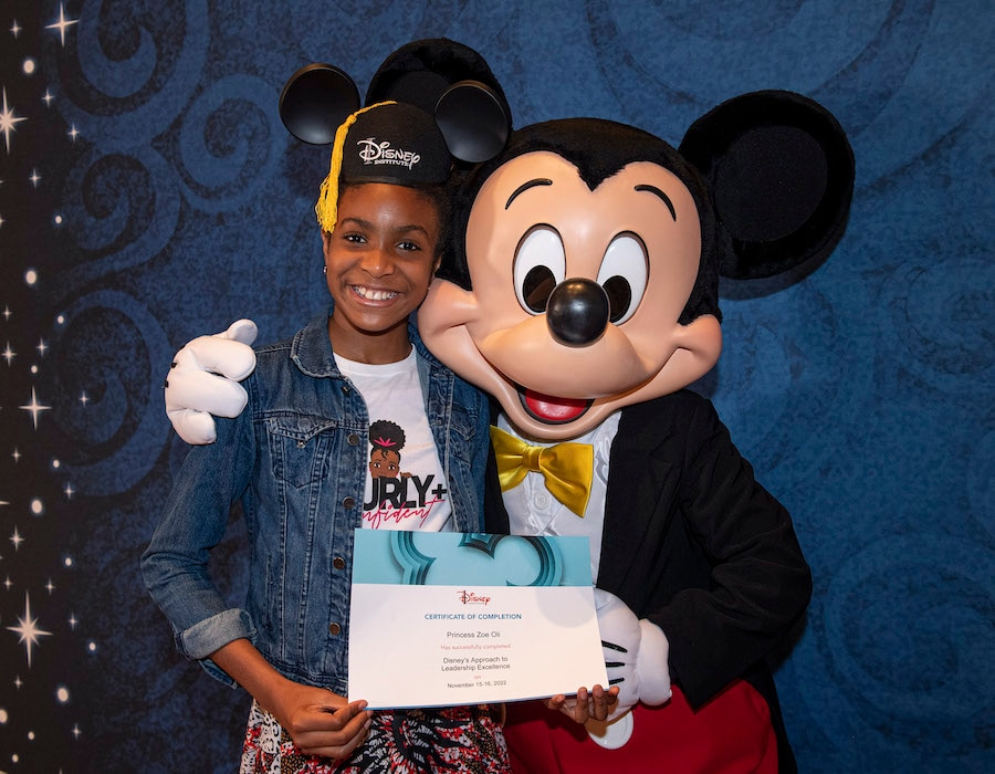 Attendee of a Disney Institute program with Mickey Mouse