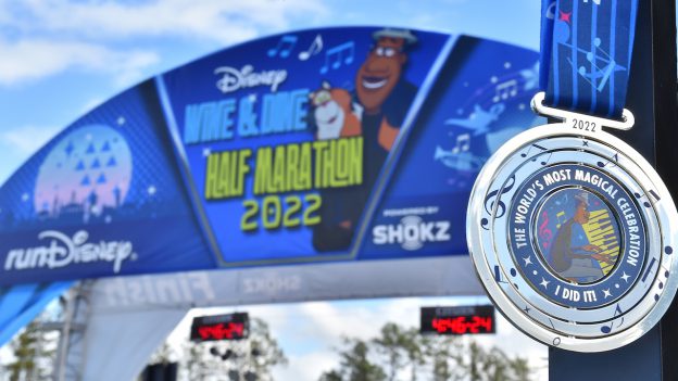 Banner and medal at the runDisney 2022 Disney Wine & Dine Half Marathon Weekend powered by Shokz!