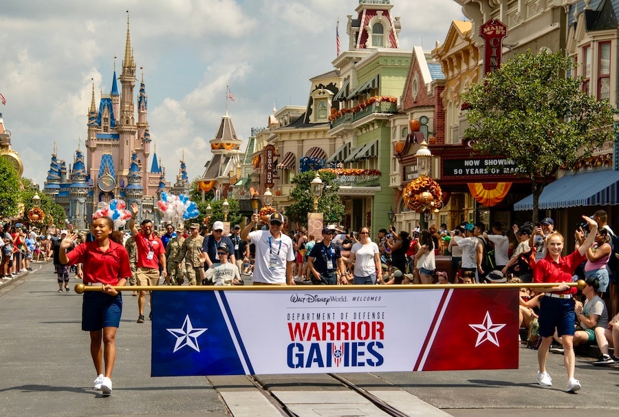 Warrior Games athletes march down Main Street U.S.A. in Magic Kingdom Park at Walt Disney World Resort Aug. 18, 2022 as part of opening day activities before the nine-day competition began at the ESPN Wide World of Sports Complex.  