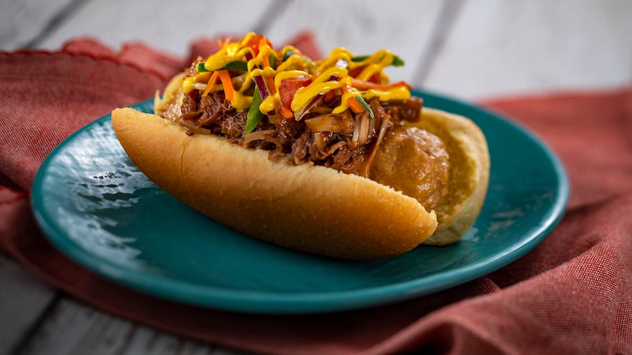 Plant-based Bratwurst with spicy turmeric aïoli, coffee barbecue jackfruit, and slaw EPCOT International Festival of the Arts 2023