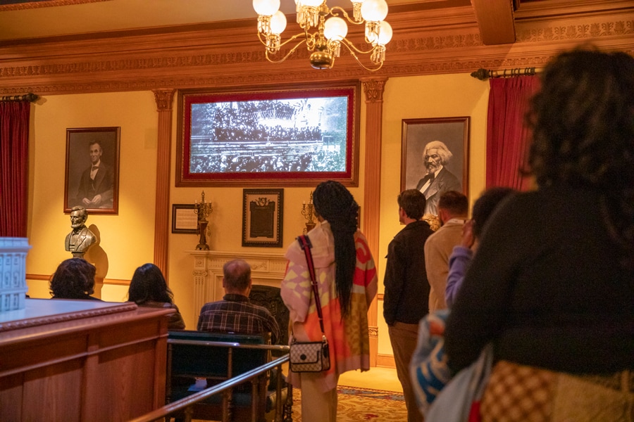 Cast watch the new feature play inside the Main Street Opera House