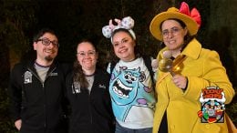 Team members including one dressed as a detective strike a pose during Minnie's Moonlit Madness