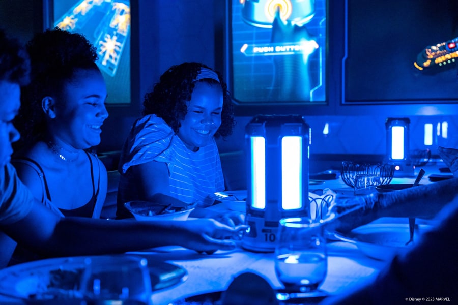 Guests dining in the Worlds of Marvel restaurant