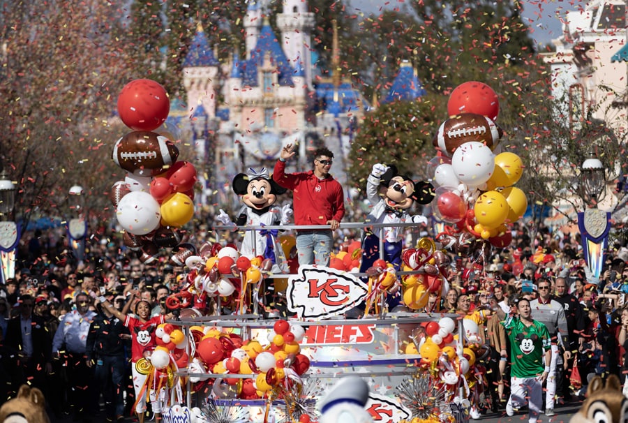 Patrick Mahomes joined Mickey Mouse and his pals in a celebratory cavalcade, as he waved to enthusiastic fans along the parade route from “it’s a small world” all the way down Main Street, U.S.A.