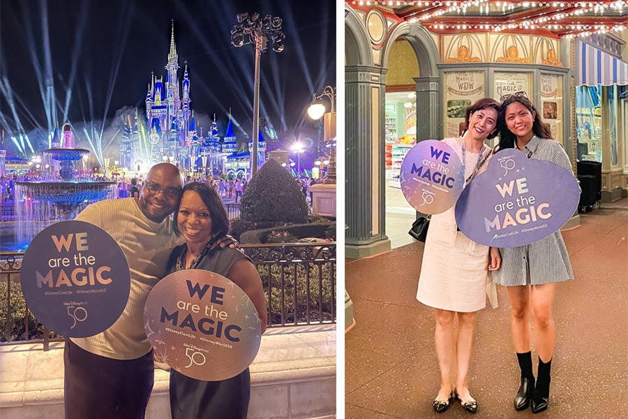Cast Members pose with We Are the Magic signs