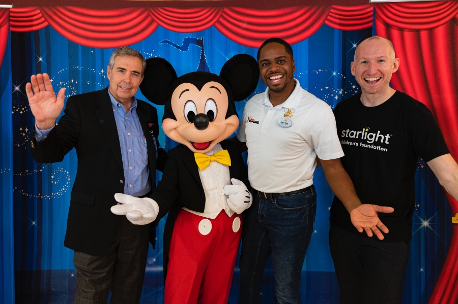 WDW Ambassador and Mickey Mouse with AdventHealth Tampa CEO and Starlight Children's Foundation Representative