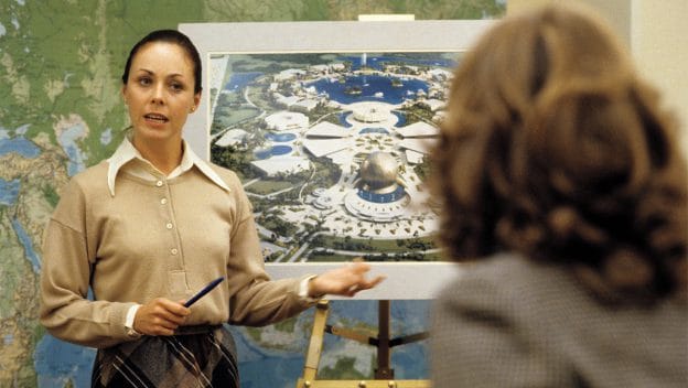 Woman presenting in front of map