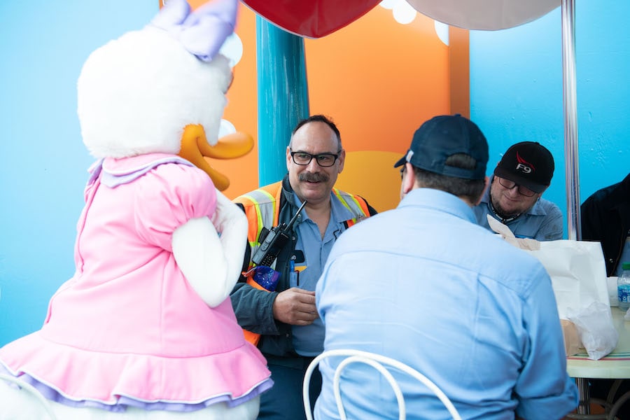 Daisy Duck greets Facilities cast members enjoying new food items