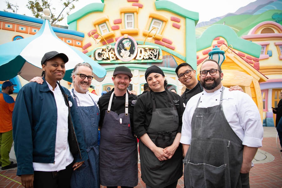 Food & Beverage cast pose in front of the reimagined Cafe Daisy